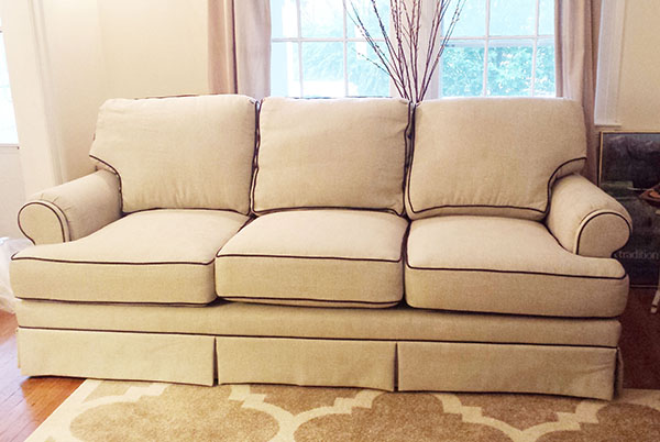 Lovely neutral sofa with a brown contrast trim