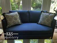 Reupholstered blue love seat